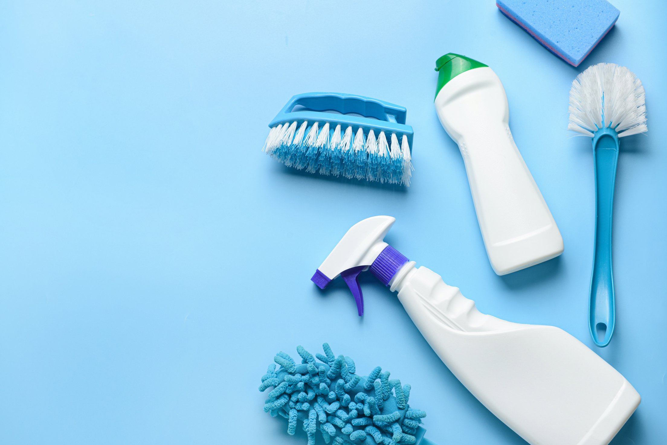 Set of Cleaning Supplies on Color Background